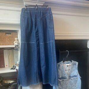 Long Denim skirt looks great w this vest and boots.